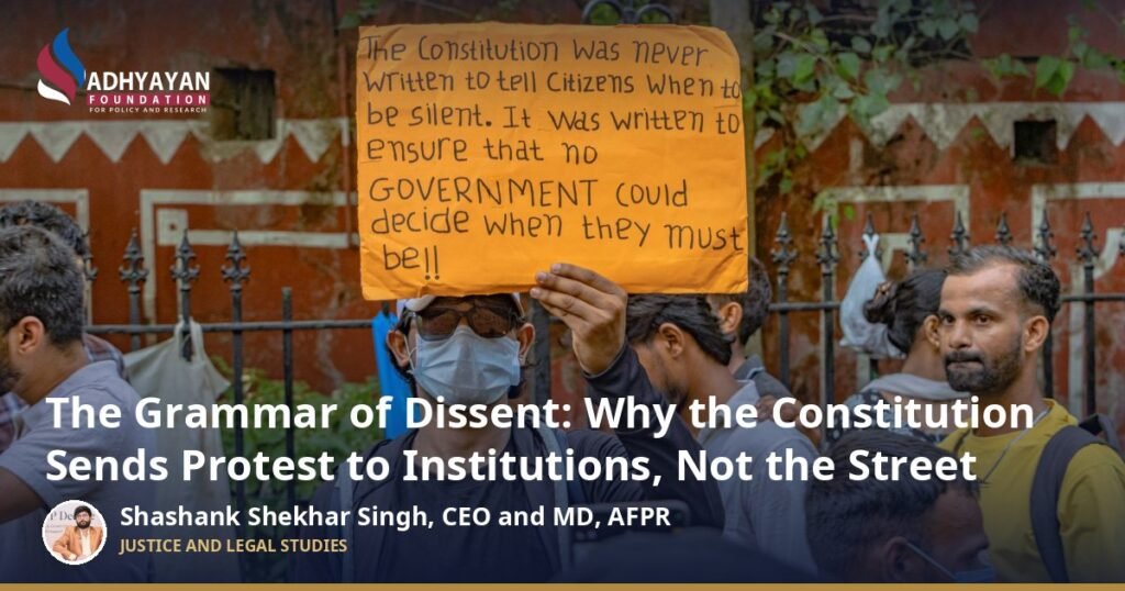 Right to protest in India: a protester at a peaceful demonstration in New Delhi holds a placard about the Constitution