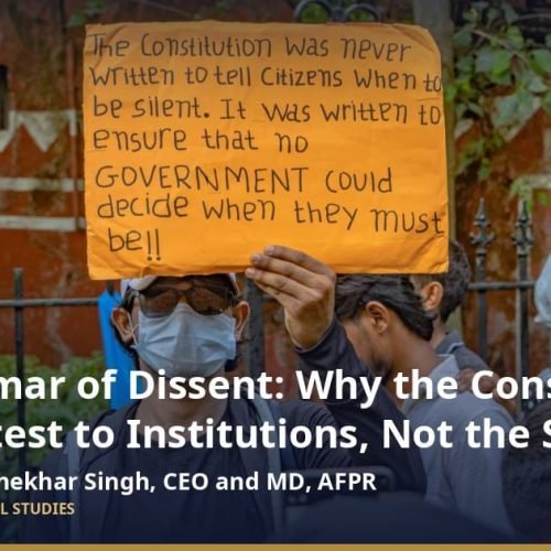 Right to protest in India: a protester at a peaceful demonstration in New Delhi holds a placard about the Constitution